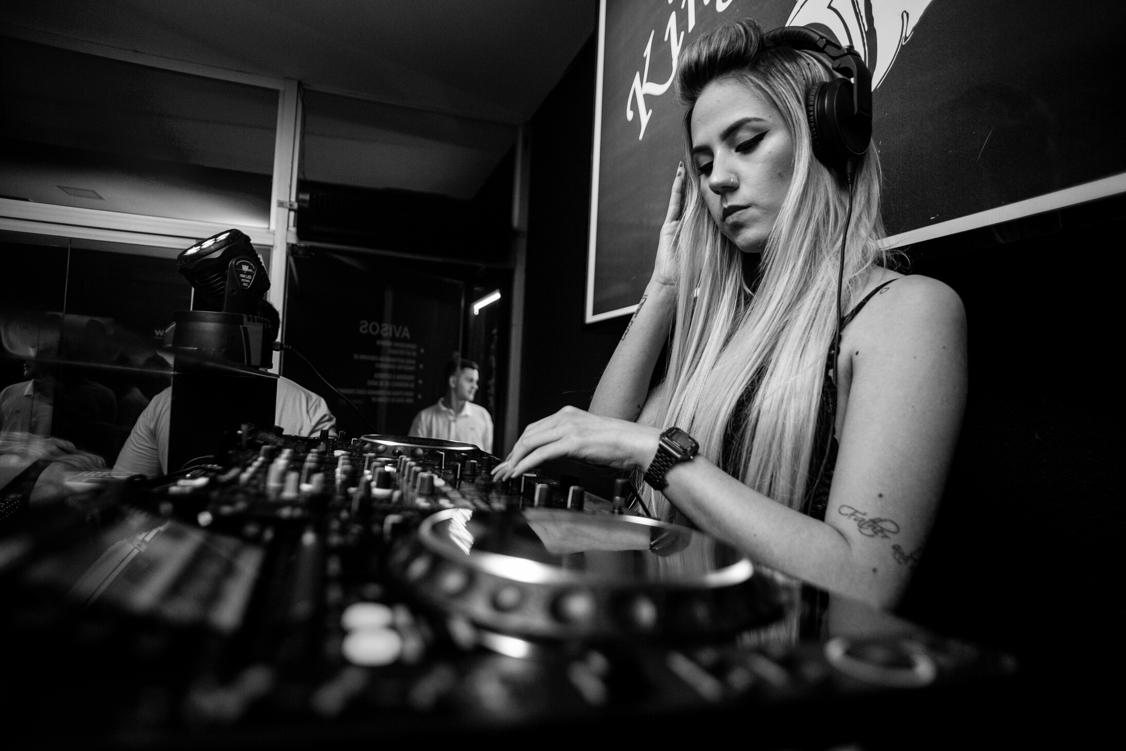 Female DJ Mixing Music in a Club 